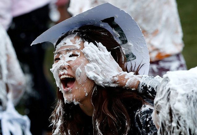 Students from St Andrews University are covered in foam as they take part in the traditional Raisin Weekend in the Lower College Lawn, at St Andrews in Scotland on October 22, 2018. (Photo by Russell Cheyne/Reuters)