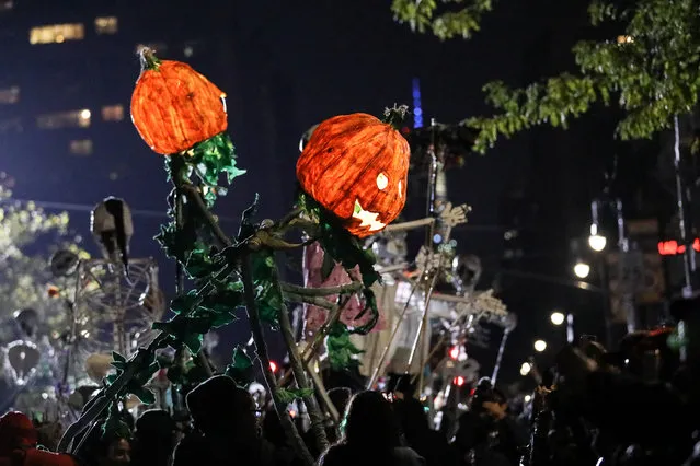 People in costume participate in the 45th Annual Village Halloween Parade in Manhattan, New York on October 31, 2018. (Photo by Jeenah Moon/Reuters)