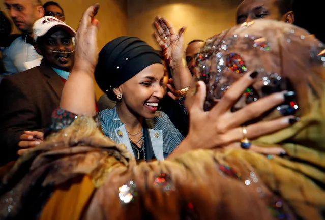 Democratic congressional candidate Ilhan Omar is greeted by her husband's mother after appearing at her midterm election night party in Minneapolis, Minnesota, U.S. November 6, 2018. (Photo by Eric Miller/Reuters)
