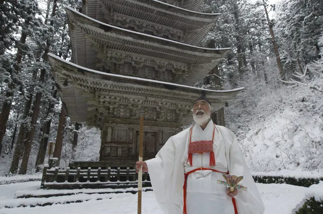 In this photo released 29 December 2016 is seen the renowned Japanese yamabushi, mountain priest, Fumihiro Hoshino during his ascetic training on Haguro Mountain in the Dewa Sanzan pilgrimage region of Tsuruoka city, Yamagata prefecture, Japan, 28 December 2016. Hoshino is part of a 1,400 year old mountain asceticism tradition, called yamabushi. The mountain priests engage in mountain trekking, sleep deprivation, fasting and cold-water ablutions in order to achieve spiritual and physical cleansing. The Dewa Sansan region is a UNESCO World Heritage Site. (Photo by Everett Kennedy Brown/EPA)