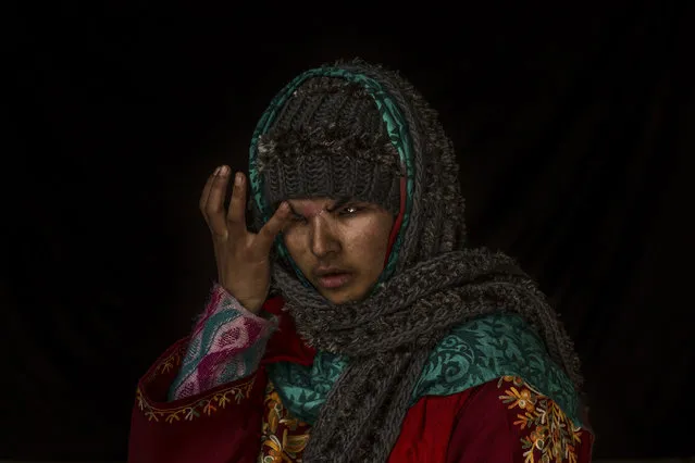 In this November 29, 2016 photo, Insha Mushtaq Malik poses for a portrait inside her home in Sedow, south Kashmir. Insha said she was standing by the window of her village home watching protesters and troops skirmish when more than a 100 pellets hit her face, “Everything looks dark and black”. Five months after she lost her eyes. Malik is still learning how to deal with her loss, both emotionally and practically. (Photo by Bernat Armangue/AP Photo)
