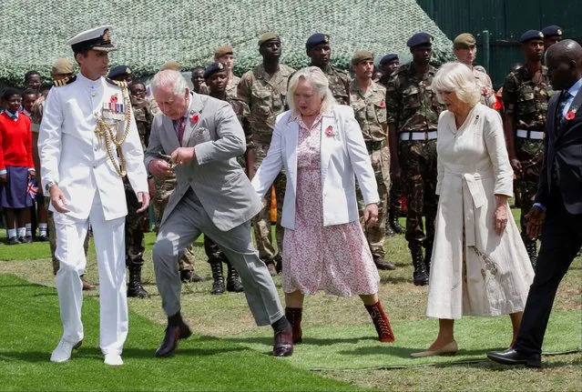 Britain's King Charles and Queen Camilla, along with Kenyan military personnel, visit the Kariokor Commonwealth War graves cemetery in an act of remembrance, in Nairobi, Kenya on November 1, 2023. (Photo by Monicah Mwangi/Reuters)