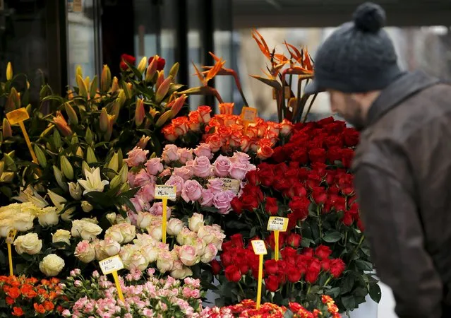 A man looks at flowers on Valentine's Day in Zagreb, Croatia, February 14, 2016. (Photo by Antonio Bronic/Reuters)