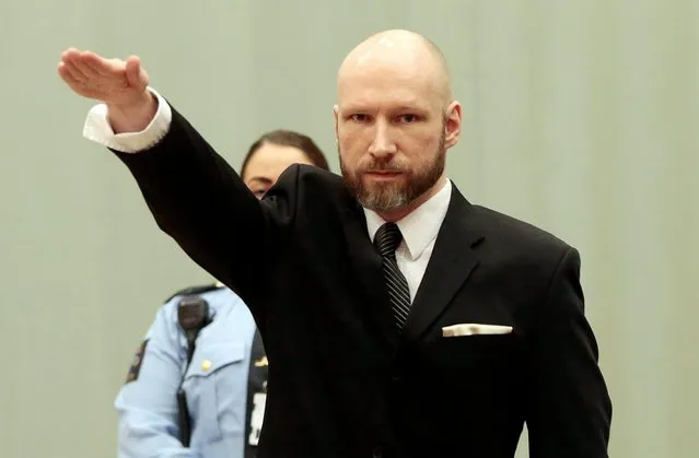 Anders Behring Breivik raises his right arm at the appeal case in Borgarting Court of Appeal at Telemark prison in Skien, Norway, 10 January 2017. The Norwegian Ministry of Justice and Breivik have both appealed the Oslo District Court's judgment of 20 April 2016 as Breivik is charging Norwegian authorities of violating his human rights by holding him in isolation for almost five years. The Court of Appeal will examine whether Breivik's prison conditions are in violation of the European Convention of Human rights. Mass murderer Anders Behring Breivik was sentenced to a maximum term of 21 years for killing 77 people in bomb and shooting attacks on 22 July 2011. (Photo by Lise Aaserud/EPA)