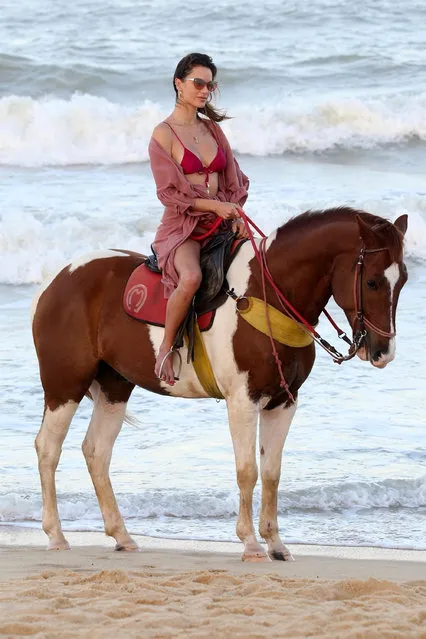 Brazilian model Alessandra Ambrosio and her beau Richard Lee go horseback riding on the beach in Trancoso, Brazil on August 5, 2021. (Photo by Backgrid USA)