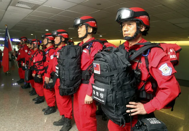 Taiwan's emergency search and rescue team members stand for inspection before heading to Nepal to assist with the earthquake relief effort at the Taoyuan International Airport in Taoyuan, Taiwan, Tuesday, April 28, 2015. (Photo by Chiang Ying-ying/AP Photo)