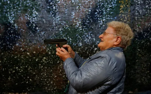 A visitor holds and tries a CO2 handgun during the 45th edition of the Arms Trade Fair, in Lucerne, on March 29, 2019. Switzerland, where gun culture has deep roots, has managed to avoid the charged national debates surrounding firearm ownership that have consumed other countries. But in a country where compulsory military service means that many are comfortable around weapons, voters might, in a May 2019 referendum, push back against gun reforms demanded by the European Union. (Photo by Stefan Wermuth/AFP Photo)