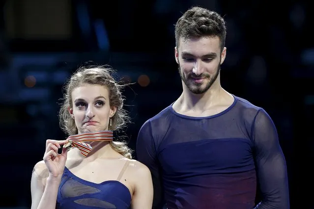 Figure Skating, ISU World Figure Skating Championships, Ice Dance Free Dance, Boston, Massachusetts, United States on March 31, 2016: France's Gabriella Papadakis holds up her gold medal on the medal podium with partner Guillaume Cizeron. (Photo by Brian Snyder/Reuters)