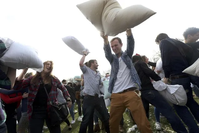 Participants take part in International Pillow Fight Day in Kennington Park in south London, Britain April 2, 2016. (Photo by Neil Hall/Reuters)