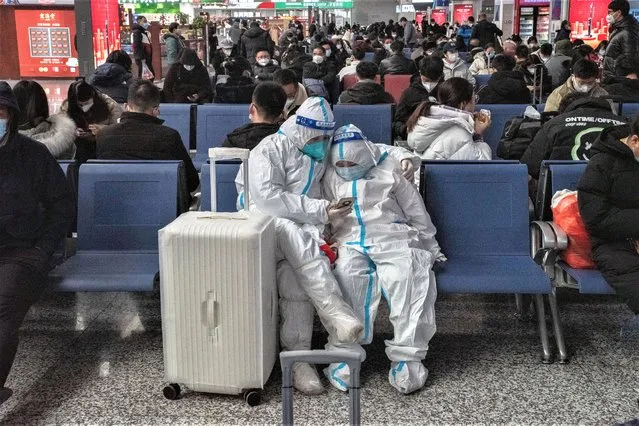 Travelers wearing protective gear at Jinan West Railway Station in Jinan, Shandong province, China, on Sunday, January 15, 2023. There are growing concerns that this months Lunar New Year holiday will see the virus sweep through smaller cities and rural areas as hundreds of thousands of people travel home, with many finally able to reunite with family after three years. (Photo by Bloomberg/Getty Images)