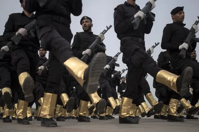 Members of the Palestinian security forces loyal to Hamas, display their skills during a graduation ceremony in Gaza City, Sunday, December 12, 2021. Gaza’s Hamas rulers collect millions of dollars a month in taxes and customs at a crossing on the Egyptian border – providing a valuable source of income that helps it sustain a government and powerful armed wing. After surviving four wars and a nearly 15-year blockade, Hamas has become more resilient and Israel has been forced to accept that its sworn enemy is here to stay.  (Photo by Khalil Hamra/AP Photo)
