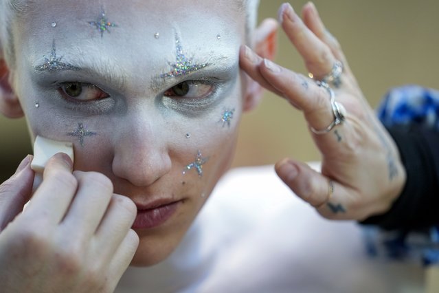 A model has make-up applied backstage ahead of the Thom Browne collection presentation during Fashion Week, Tuesday, February 14, 2023, in New York. (Photo by Mary Altaffer/AP Photo)
