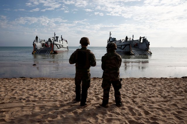 French troops stand on the beach after disembarking from a U.S. landing craft during a joint U.S. and French amphibious landing operation showcase at Omaha Beach, ahead of the 80th anniversary of the 1944 D-Day landings in Saint-Laurent-sur-Mer, Normandy region, France, on June 4, 2024. (Photo by Benoit Tessier/Reuters)