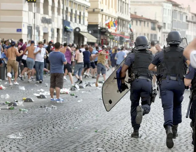 Police chase England fans ahead of England's EURO 2016 match in Marseille, France, June 10, 2016. (Photo by Jean-Paul Pelissier/Reuters)