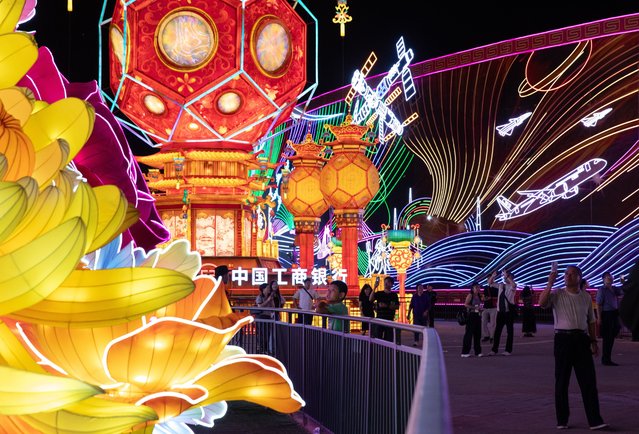 People celebrate the Mid-Autumn Festival in Beijing, China, 17 September 2024. The Mid-Autumn Festival, also known as the Mooncake Festival, is celebrated on the 15th day of the eighth month in the traditional Chinese lunar calendar, which this year falls on 17 September. (Photo by Jessica Lee/EPA)