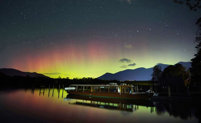 A spectacular display of the Northern Lights seen over Derwentwater, near Keswick in the Lake District, last night and into the early hours of Thursday, November 4, 2021. (Photo by Owen Humphreys/PA Images via Getty Images)