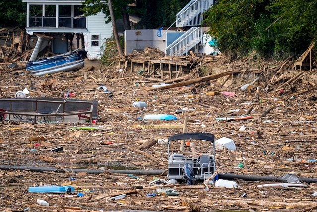 Debris is strewn on the lake in the aftermath of Hurricane Helene, Wednesday, October 2, 2024, in Lake Lure, N.C. (Photo by Mike Stewart/AP Photo)