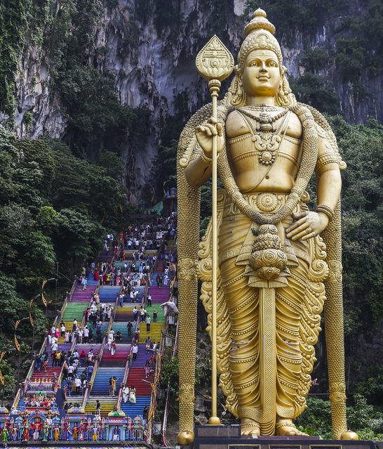 The statue of Murugan stands near the base of the 272 steps leading to the Batu Caves temple on World Tourism Day, in Kuala Lumpur, Malaysia, 27 September 2024. Batu Caves temple is a stunning and historical place and I like the culture so much', Simon, 35, a tourist from Italy said. This year World Tourism Day is observed under the theme “Tourism and Peace”, aiming to highlight its role in fostering peace and understanding between countries and cultures, according to the United Nations. World Tourism Day has been marked annually on 27 September since 1980. (Photo by Fazry Ismail/EPA)