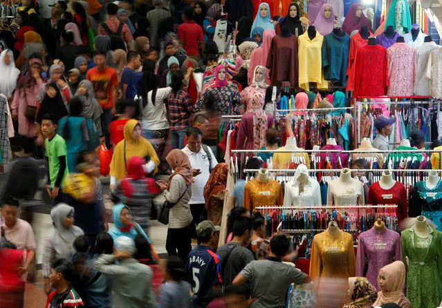 Shoppers flock to the Tanah Abang traditional market ahead of next week's Eid al-Fitr holiday marking the end of Ramadan in Jakarta, Indonesia, June 29, 2016. (Photo by Iqro Rinaldi/Reuters)