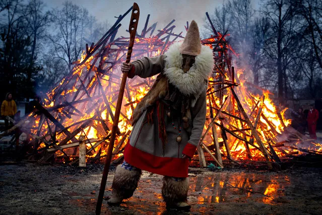 Burning an effigy of winter during a celebration of Maslenitsa festival (Pancake Week) at the Guslitsa Art Estate in Moscow Region, Russia on March 1, 2020. The holiday celebrates the end of winter and marks the arrival of spring. (Photo by Stanislav Krasilnikov/TASS)