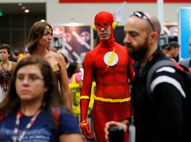 An attendee dressed as the Flash walks the convention floor at the pop culture event Comic-Con International in San Diego, California, United States July 22, 2016. (Photo by Mike Blake/Reuters)