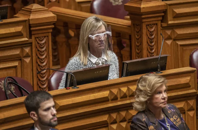 A Portuguese parliamentarian wears a protective visor during the biweekly debate in the Assembly of the Republic due to the COVID-19 Coronavirus pandemic on April 22, 2020 in Lisbon, Portugal. With 785 deaths, 21.982 confirmed cases and 1143 cured patients the country is coping with the COVID-19 Coronavirus crisis and continues under a state of emergency that, among other things, severely restricts the population's unnecessary movements. (Photo by Horacio Villalobos#Corbis/Corbis via Getty Images)