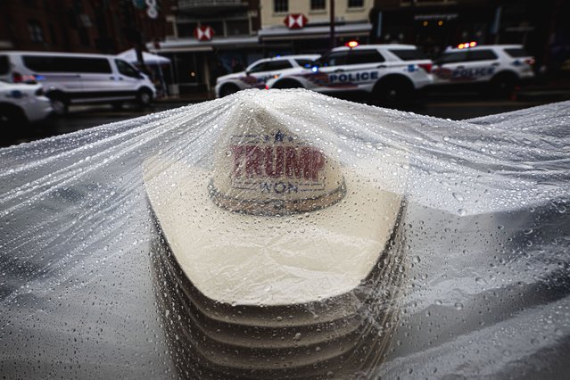 Trump hats are protected from the rain as attendees wait to enter the Donald Trump victory rally at the Capital One Arena in Washington DC, US on January 20, 2025. (Photo by Dave Decker/Zuma Press Wire/Rex Features/Shutterstock)