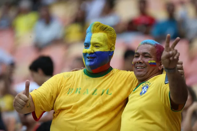 Fans of Colombia and Sweden pose for a photo during a group B match of the men's Olympic football tournament between Sweden and Colombia at the Amazonia Arena, in Manaus, Brazil, Thursday, August 4, 2016. (Photo by Michael Dantas/AP Photo)