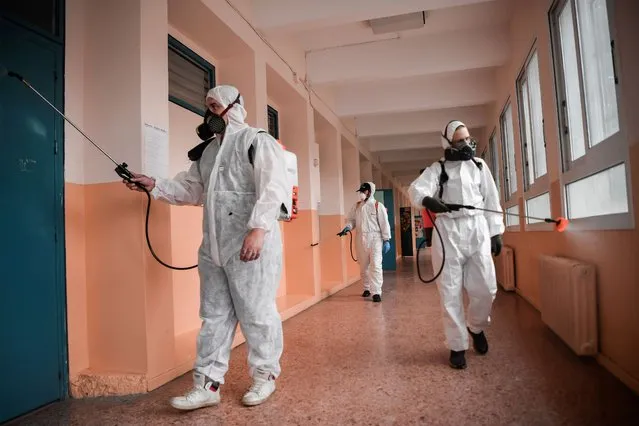 Employees disinfect and clean the hallways of a kindekindergartenAthens, on May 31, 2020 on the eve of their reopening as Greece eases lockdown measures taken to curb the spread of the COVID-19 (the novel coronavirus). (Photo by Louisa Gouliamaki/AFP Photo)