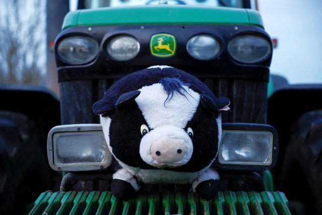 A stuffed toy sits on a tractor blocking a highway during a protest over price pressures, taxes and green regulation, grievances shared by farmers across Europe, in Chennevieres-les-Louvres, near Paris, France on January 29, 2024. (Photo by Benoit Tessier/Reuters)