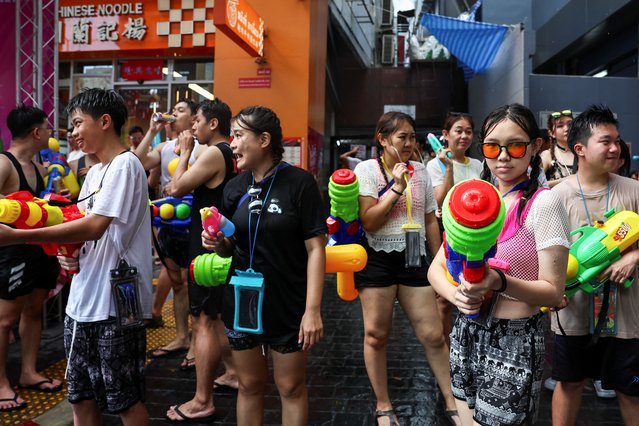 Revellers carry water guns as they celebrate the Songkran holiday, which marks the Thai New Year, in Bangkok, Thailand, on April 13, 2025. (Photo by Chalinee Thirasupa/Reuters)