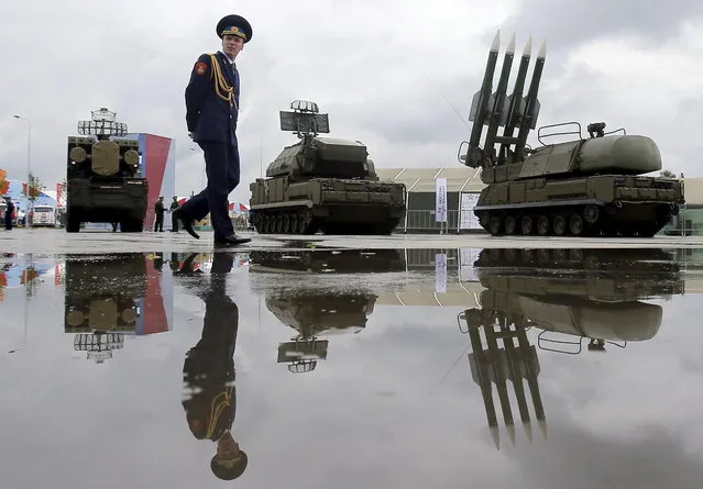 A Russian serviceman walks past the Buk-1M missile system at the Army-2015 international military forum in Kubinka, outside Moscow, June 16, 2015. (Photo by Maxim Shemetov/Reuters)