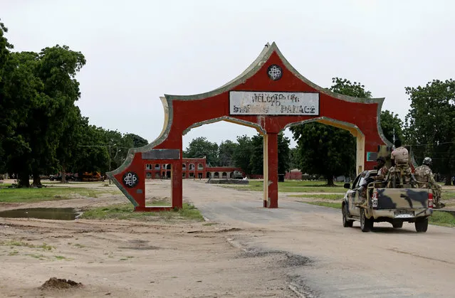 A military vehicle drives into the Emir's palace in Bama, which was the former headquarters of the Boko Haram militants in Bama, Borno, Nigeria, August 31, 2016. (Photo by Afolabi Sotunde/Reuters)