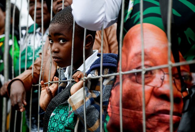 A child listens, as former South African President Jacob Zuma addresses supporters in front of the High Court in Pietermaritzburg, South Africa, on April 24, 2025. (Photo by Rogan Ward/Reuters)