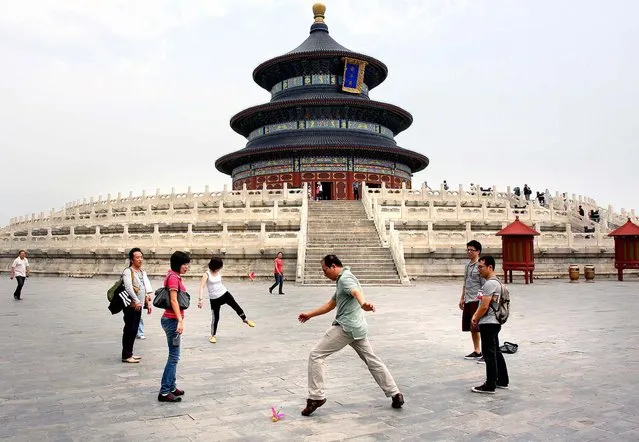 Tourists play Hacky Sack in The Forbidden City. (Photo by Mark Edelson/The Palm Beach Post)
