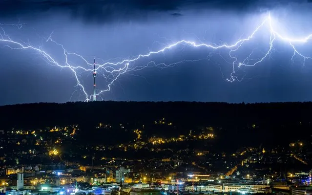 Lightning is seen over the city of Stuttgart, southern Germany, early Saturday, July 27, 2019 as the heat wave in large parts of Europe gives way to storms and heavy rain. (Photo by Simon Adomat/dpa via AP Photo)