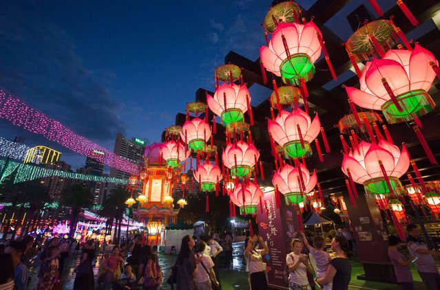 Lanterns hang in Victoria Park in celebration of the full moon during the Chinese mid-Autumn Festival in Hong Kong, China, 15 September 2016. The festival is celebrated by ethnic Chinese, Koreans and Vietnamese people. It is also known as the Moon Festival or Moon Cake Festival. (Photo by Alex Hofford/EPA)