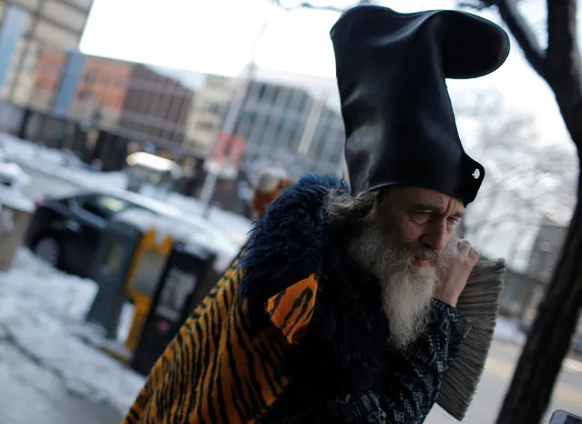 Vermin Supreme, a candidate for U.S. president, leans on a broom on Elm street in downtown Manchester, New Hampshire, February 6, 2016. (Photo by Mike Segar/Reuters)