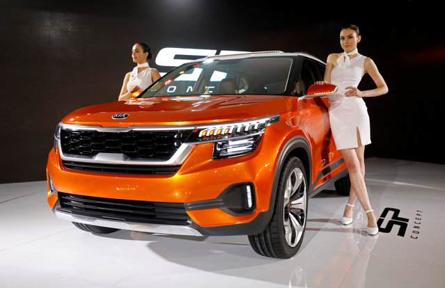 Models pose alongside the Kia SP SUV Concept car after its launch at India Auto Show 2018 in Greater Noida, February 7, 2018. (Photo by Saumya Khandelwal/Reuters)