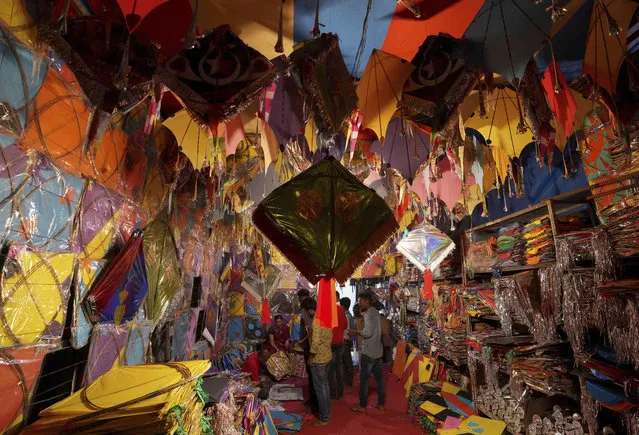 People buy kites ahead of the Hindu festival Makar Sankranti in Hyderabad, India, Saturday, January 7, 2023. The festival marks the transition of winter to spring. (Photo by Mahesh Kumar A./AP Photo)