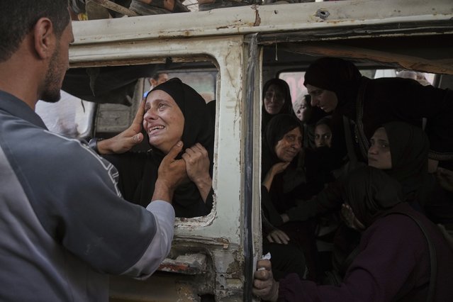Palestinians mourn their relatives killed from an Israeli army bombardment of Gaza, at Shifa Hospital in Gaza City Tuesday, July 22, 2025. (Photo by Jehad Alshrafi/AP Photo)