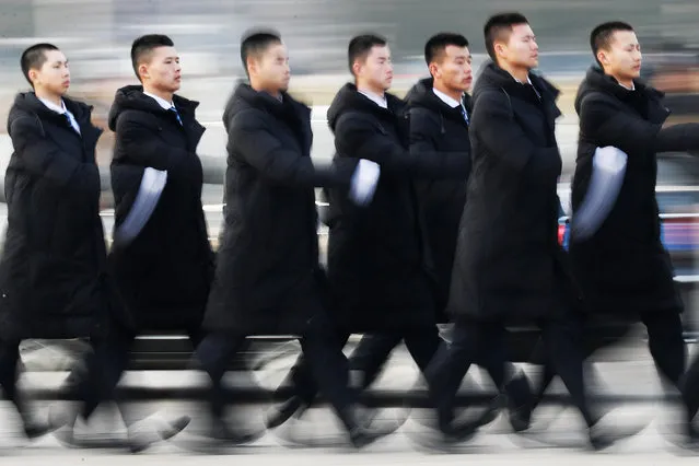 Security personnel are deployed around the Great Hall of the People before the opening session of the National People's Congress (NPC) in Beijing, China on March 5, 2018. (Photo by Damir Sagolj/Reuters)