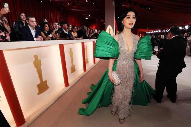 Chinese actress Fan Bingbing poses on the champagne-colored red carpet during the Oscars arrivals at the 95th Academy Awards in Hollywood, Los Angeles, California, U.S., March 12, 2023. (Photo by Mario Anzuoni/Reuters)