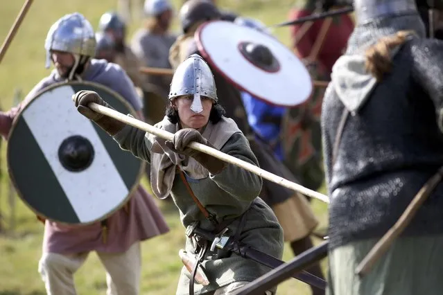 Re-enactors participate in a re-enactment of the Battle of Hastings, commemorating the 950th anniversary of the battle, in Battle, Britain October 15, 2016. (Photo by Neil Hall/Reuters)