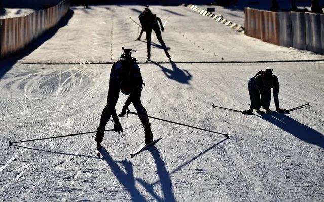 Athletes react in the finish area during the women’s 7,5 km event of the IBU Biathlon World Cup in Hochfilzen, Austria on December 18, 2020. (Photo by Barbara Gindl/APA/AFP Photo)