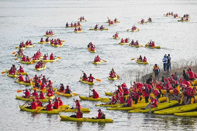 Participants take part in a canoeing event along the Mahaweli River during the “Raid Amazones 2023”, a women's adventure race, in Digana village some 17 Km from Kandy on March 23, 2023. (Photo by Ishara S. Kodikara/AFP Photo)