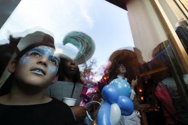 A child observes the Macy's Thanksgiving Day Parade during the Macy's Thanksgiving Day Parade 2025, in New York City, U.S., November 27, 2025. (Photo by Brendan McDermid/Reuters)
