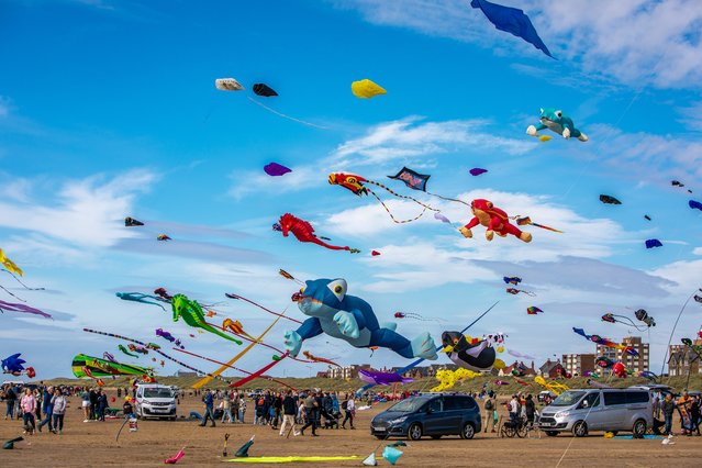 The skies are awash with colour at the St Annes International Kite Festival in Lancashirel, northwest England, on September 9, 2024. Fanatics from across the globe took part in the three-day festival, which also offers a funfair, food and fireworks. (Photo by Gregg Wolstenholme/Bav Media)