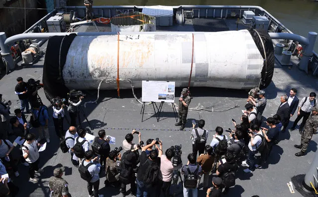 The South Korean military reveals a sunken part of North Korea's ill-fated “Chollima-1” rocket at the Navy's 2nd Fleet Command in Pyeongtaek on South Korea's west coast, 16 June 2023, after salvaging it from the Yellow Sea on 15 June. The rocket was carrying a North Korean military reconnaissance satellite that crashed into sea following a launch failure on 31 May 2023, according to South Korea's Joint Chiefs of Staff (JCS). (Photo by Yonhap/EPA/EFE)