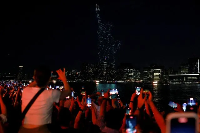 Drones form the shape of the Statue of Liberty as people celebrate U.S. Independence Day in New York City, U.S., July 4, 2023. (Photo by Amr Alfiky/Reuters)